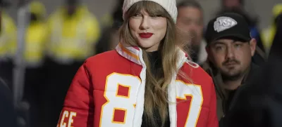 FILE - Taylor Swift wears a Kansas City Chiefs tight end Travis Kelce jacket as she arrives before an NFL wild-card playoff football game between the Chiefs and the Miami Dolphins, Saturday, Jan. 13, 2024, in Kansas City, Mo. A scourge of pornographic deepfake images generated by artificial intelligence and sexualizing people without their consent has hit its most famous victim, singer Taylor Swift, drawing attention to a problem that tech platforms and anti-abuse groups have struggled to solve. (AP Photo/Ed Zurga, File)