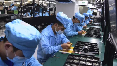 ﻿In this Feb. 13, 2020, photo released by Xinhua News Agency, workers wearing masks labor at a factory for Chinese telecommunications company OPPO in Dongguan, in southern China's Guangdong Province. Factories in China, struggling to reopen after the coronavirus shut down the economy, face a new threat from U.S. anti-disease controls that might disrupt the flow of microchips and other components they need. For most people, the new coronavirus causes only mild or moderate symptoms. For some it can cause more severe illness. (Chen Yuxuan/Xinhua via AP)
