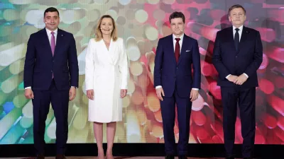 Presidential candidates George Simion, Elena Lasconi, Nicusor Dan and Crin Antonescu pose for a family photo at the start of a presidential debate hosted by Digi24 TV station in Bucharest, Romania, April 28, 2025. Inquam Photos/Octav Ganea via REUTERS ATTENTION EDITORS - THIS IMAGE WAS PROVIDED BY A THIRD PARTY. ROMANIA OUT. NO COMMERCIAL OR EDITORIAL SALES IN ROMANIA