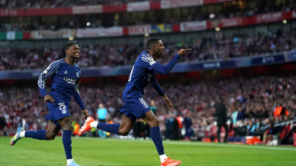 29 April 2025, United Kingdom, London: Paris Saint Germain's Ousmane Dembele (R) celebrates scoring his side's first goal of the game during the UEFA Champions League semi final, first leg match between Arsenal and Paris Saint Germain at the Emirates Stadium. Photo: Adam Davy/PA Wire/dpa