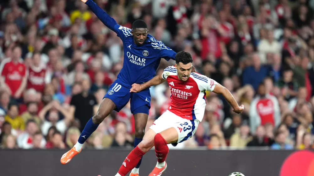 29 April 2025, United Kingdom, London: Paris Saint Germain's Ousmane Dembele (left) and Arsenal's Mikel Merino battle for the ball during the UEFA Champions League semi final, first leg match between Arsenal and Paris Saint Germain at the Emirates Stadium. Photo: Adam Davy/PA Wire/dpa