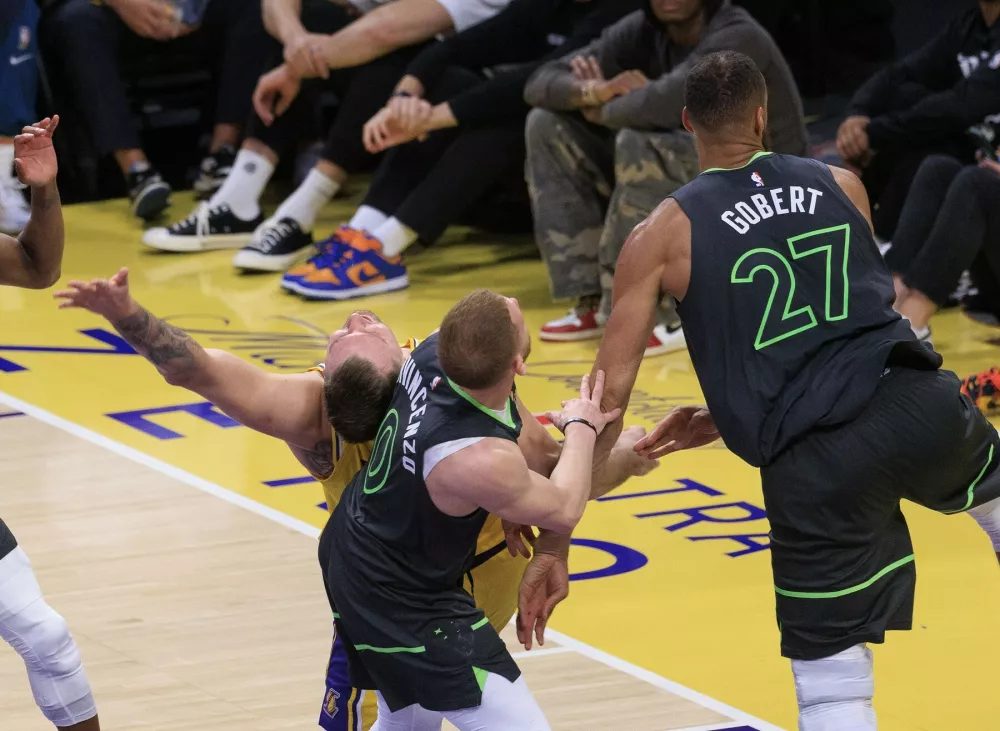 April 30, 2025, Los Angeles, California, USA: Luka Doncic #77 of the Los Angeles Lakers is hit by Donte DiVincenzo #0 of the Minnesota Timberwolves goes to the basket during Round One Game Five of the 2025 NBA Playoffs on Wednesday April 30, 2025 at Crypto.com Arena in Los Angeles, California. JAVIER ROJAS/PI,Image: 994070615, License: Rights-managed, Restrictions:, Model Release: no