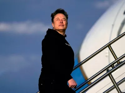 Tesla CEO Elon Musk boards Air Force One with U.S. President Donald Trump (not pictured) as they depart for Philadelphia, Pennsylvania, from Morristown Municipal Airport in Morristown, New Jersey, U.S., March 22, 2025. REUTERS/Nathan Howard