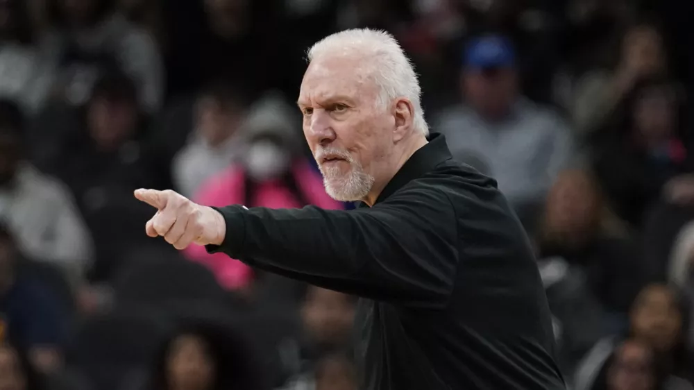 San Antonio Spurs coach Gregg Popovich signals to players during the first half of an NBA basketball game against the Utah Jazz, Friday, March 11, 2022, in San Antonio. (AP Photo/Eric Gay)