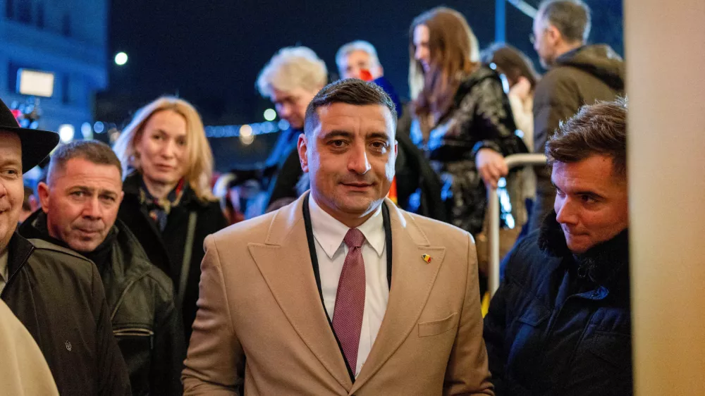 FILE PHOTO: The leader of the radical right Alliance for Uniting Romanians (AUR) party, George Simion, looks on following initial exit polls at the party's campaign headquarters on the day of the parliamentary election, in Bucharest, Romania, December 1, 2024. REUTERS/Alkis Konstantinidis/File Photo