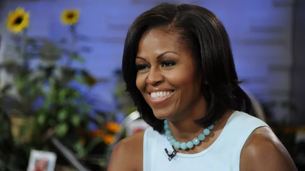 This image released by ABC shows first lady Michelle Obama on the morning program "Good Morning America," Tuesday, May 29, 2012 in New York. Obama discussed a variety of topics including her new book "American Grown: The Story of the White House Kitchen Garden and Gardens Across America," which promotes healthy eating. (AP Photo/ABC, Ida Mae Astute)