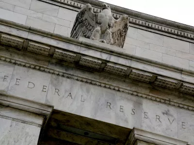 FILE PHOTO: An eagle tops the U.S. Federal Reserve building's facade in Washington, July 31, 2013. REUTERS/Jonathan Ernst//File Photo