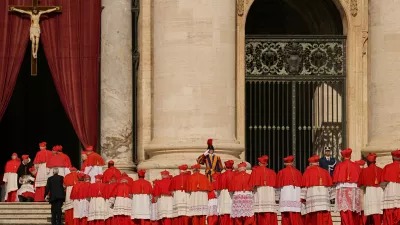 FILE - Cardinals walk through St. Peter's Square ahead of Pope Francis' coffin at the Vatican, Wednesday, April 23, 2025. (AP Photo/Andreea Alexandru, File)