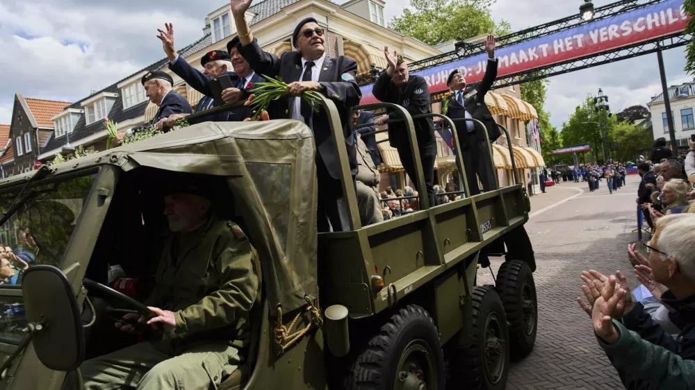 World War II veterans take part in a parade to mark Liberation Day in Wageningen, Netherlands, Monday, May 5, 2025. (AP Photo/Peter Dejong)