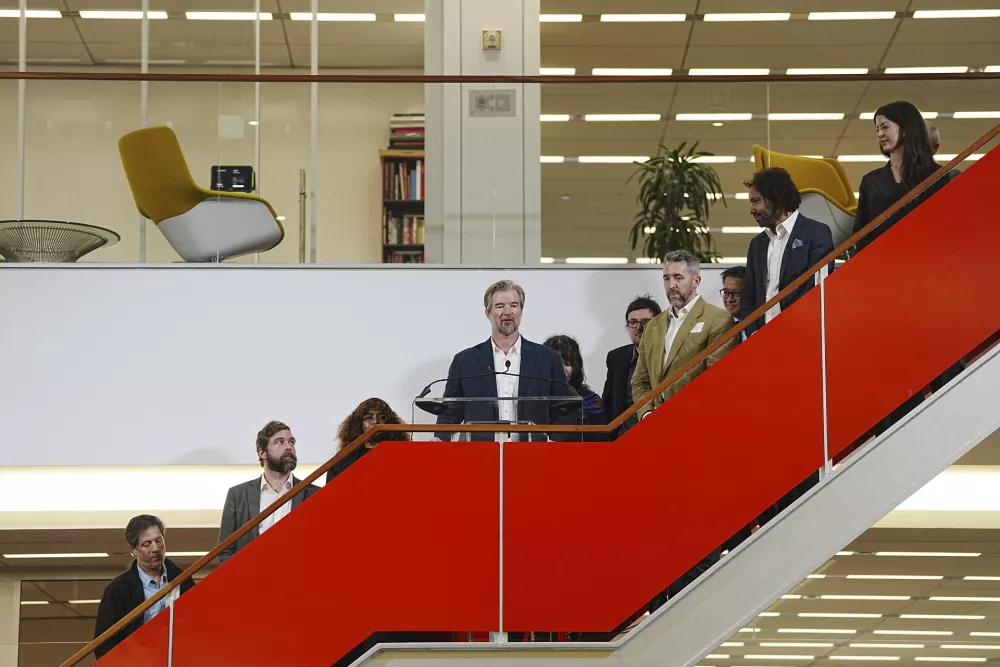 The New York Times' Declan Walsh, center, speaks alongside other members of the team who won the Pulitzer Prize for international reporting during a gathering in the newsroom in New York, Monday, May 5, 2025. (Hiroko Masuike/The New York Times via AP)