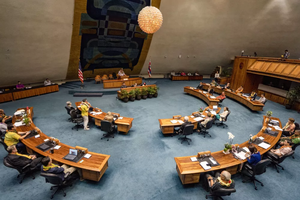 Hawaii senators are seen during the discussion of the bill that will increase the state's lodging tax, Friday, May 2, 2025, at the state Capitol in Honolulu. (AP Photo/Mengshin Lin)
