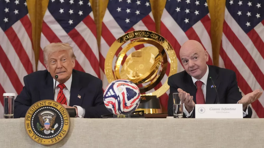 President Donald Trump listens as FIFA President Gianni Infantino speaks during a FIFA task force meeting on the 2026 FIFA World Cup in the East Room of the White House, Tuesday, May 6, 2025, in Washington. (AP Photo/Mark Schiefelbein)