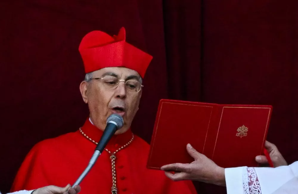 Cardinal Protodeacon Dominique Mamberti announces a new pope has been elected by the conclave at the Vatican, May 8, 2025.REUTERS/DYLAN MARTINEZ