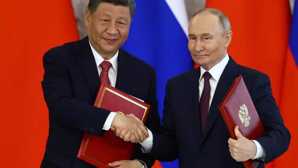 Russian President Vladimir Putin shakes hands with his Chinese counterpart Xi Jinping during a signing ceremony following their talks at the Kremlin in Moscow, Russia, May 8, 2025. REUTERS/Evgenia Novozhenina