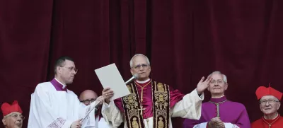Newly elected Pope Leo XIV addresses the faithful from the balcony of St. Peter's Basilica at the Vatican, Thursday, May 8, 2025. (AP Photo/Alessandra Tarantino)