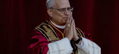 Newly elected Pope Leo XIV, formerly Cardinal Robert Francis Prevost, appears on the central loggia of St. Peter's Basilica at the Vatican shortly after his election as the 267th pontiff of the Roman Catholic Church, Thursday, May 8, 2025. (AP Photo/Domenico Stinellis)