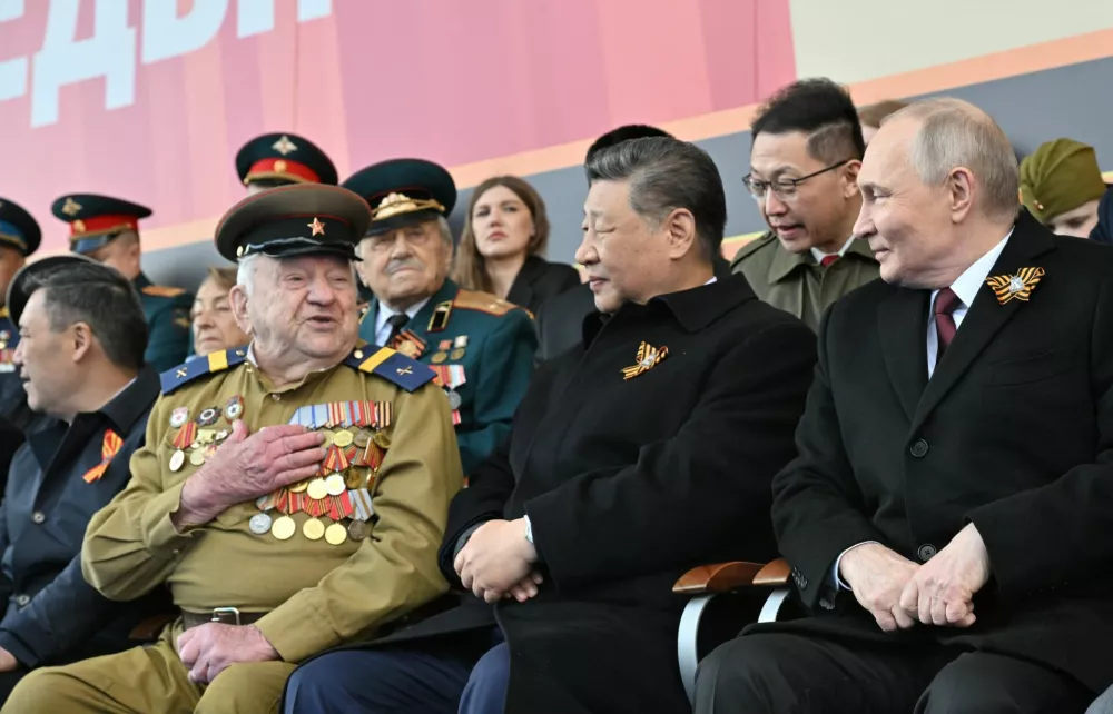 Russian President Vladimir Putin and his Chinese counterpart Xi Jinping attend a military parade on Victory Day, marking the 80th anniversary of the victory over Nazi Germany in World War Two, in Red Square in central Moscow, Russia, May 9, 2025. Ivan Sekretarev/Host agency RIA Novosti/Handout via REUTERS ATTENTION EDITORS - THIS IMAGE WAS PROVIDED BY A THIRD PARTY.