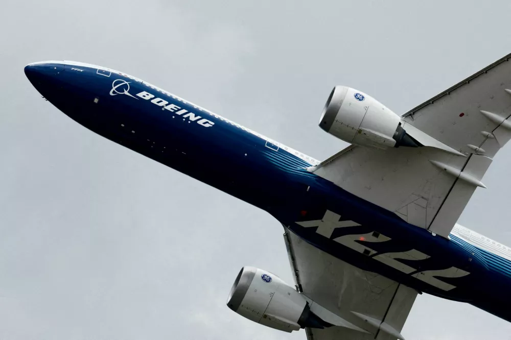 FILE PHOTO: A Boeing 777-9, a variant of the 777X, performs a flying display at the 54th International Paris Airshow at Le Bourget Airport near Paris, France, June 20, 2023. REUTERS/Benoit Tessier/File Photo