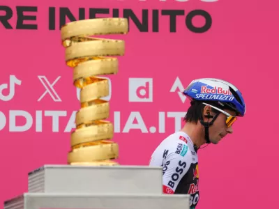 09 May 2025, Albania, Durres: Red Bull-Bora-Hansgrohe's Slovenian rider Primoz Roglic walks past the Giro d'Italia trophy prior to the first stage of the 108th Giro d'Italia cycling race, 160km from Durres to Tirana. Photo: Armando Babani/ZUMA Press Wire/dpa