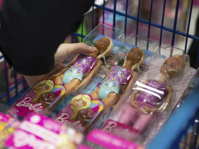 A collection of Barbie dolls are placed into a cart in Bowling Green, Ky., on Tuesday, Dec. 7, 2021. (Grace Ramey/Daily News via AP, File)