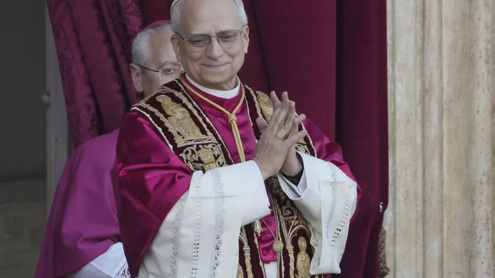 Newly elected Pope Leo XIV appears at the balcony of St. Peter's Basilica at the Vatican, Thursday, May 8, 2025. (AP Photo/Markus Schreiber)