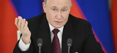 Russian President Vladimir Putin gestures as he speaks to journalists in the Grand Palace at the Kremlin in Moscow, Russia, Sunday, May 11, 2025, after celebrations of the 80th anniversary of the Soviet Union's victory over Nazi Germany during World War II. (Sergei Bobylev/Photo host agency RIA Novosti via AP)