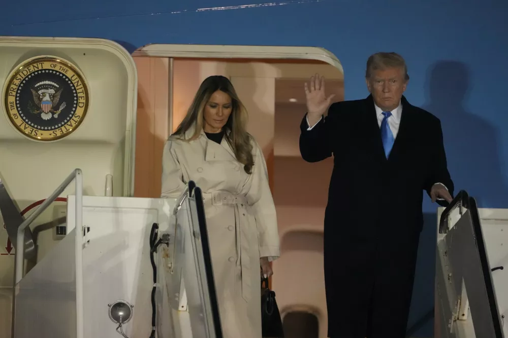 CORRECTS DATE - President Donald Trump and first lady Melania Trump arrive on Air Force One at Rome's Leonardo da Vinci International airport in Fiumicino, Friday, April 25, 2025, to attend the funeral for Pope Francis at the Vatican. (AP Photo/Markus Schreiber)