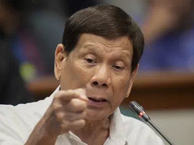 FILE - Former Philippine President Rodrigo Duterte speaks during a senate inquiry on the so-called war on drugs during his administration at the Philippine Senate Monday, Oct. 28, 2024, in Manila, Philippines. (AP Photo/Aaron Favila, File)