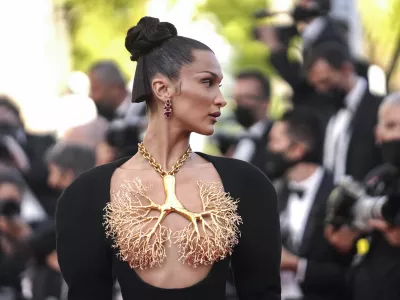 FILE -Bella Hadid poses for photographersat the premiere of 'Three Floors' at the 74th international film festival, Cannes, southern France on July 11, 2021. (AP Photo/Brynn Anderson, File)