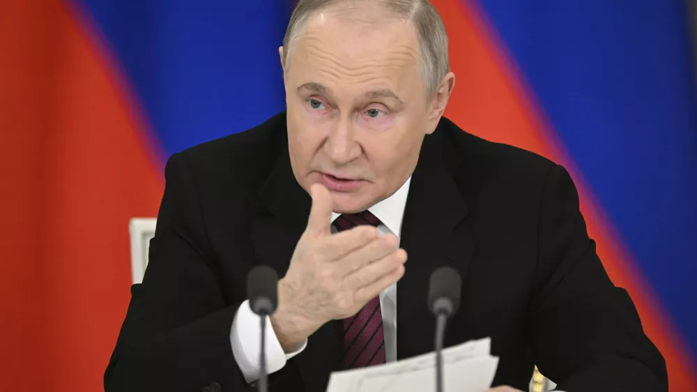 Russian President Vladimir Putin gestures as he speaks to journalists in the Grand Palace at the Kremlin in Moscow, Russia, Sunday, May 11, 2025, after celebrations of the 80th anniversary of the Soviet Union's victory over Nazi Germany during World War II. (Sergei Bobylev/Photo host agency RIA Novosti via AP)