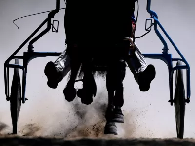 A jockey competes during Harness Racing in York, Britain, May 10, 2025. REUTERS/Lee Smith  TPX IMAGES OF THE DAY