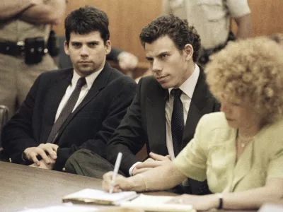 FILE - Lyle, left, and Erik Galen Menendez sit in Beverly Hills, Calif., courtroom, May 14, 1990 as a judge postponed their preliminary hearing on charges of murdering their parents last August. (AP Photo/Kevork Djansezian, File)