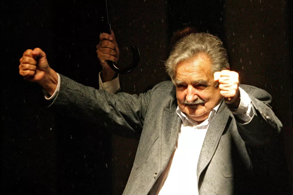 FILE PHOTO: Uruguay's president-elect Jose Mujica celebrates winning the presidential run-off election in Montevideo, Uruguay, November 29, 2009. REUTERS/Andres Stapff/File Photo