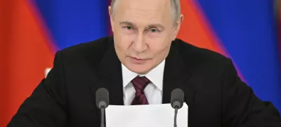 Russian President Vladimir Putin gestures as he speaks to journalists in the Grand Kremlin Palace in Moscow, Sunday, May 11, 2025. (Sergei Bobylev/Photo host agency RIA Novosti via AP)