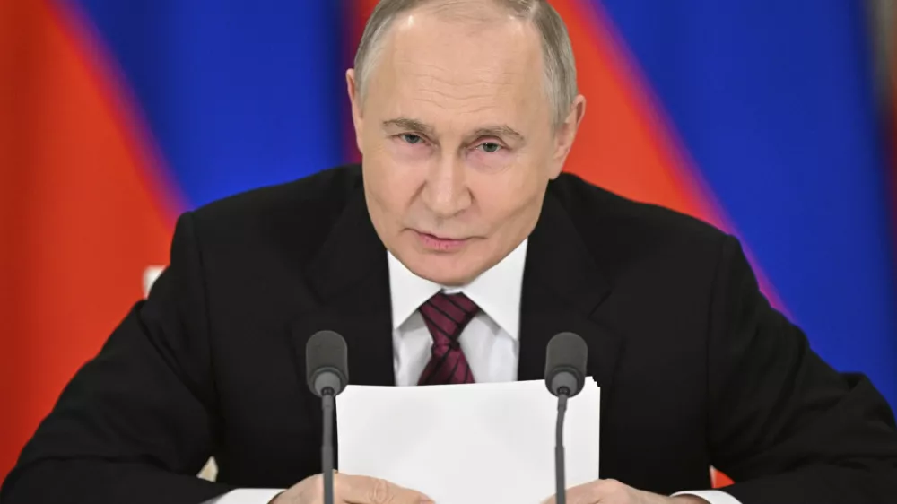 Russian President Vladimir Putin gestures as he speaks to journalists in the Grand Kremlin Palace in Moscow, Sunday, May 11, 2025. (Sergei Bobylev/Photo host agency RIA Novosti via AP)