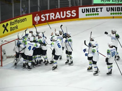 Slovenia's team celebrates winning following the IIHF Ice Hockey World Championship group A match between France and Slovenia in Stockholm, Sweden, Monday, May 19, 2025. (Fredrik Sandberg/TT News Agency via AP)