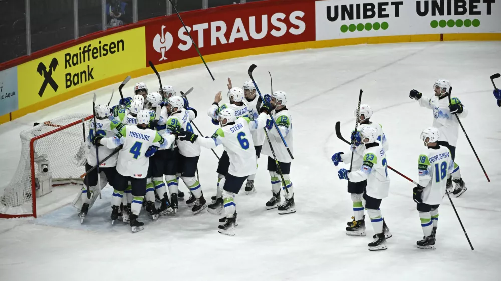 Slovenia's team celebrates winning following the IIHF Ice Hockey World Championship group A match between France and Slovenia in Stockholm, Sweden, Monday, May 19, 2025. (Fredrik Sandberg/TT News Agency via AP)