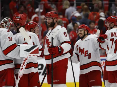 May 15, 2025; Washington, District of Columbia, USA; Carolina Hurricanes players celebrate after their series clinching win against the Washington Capitals in game five of the second round of the 2025 Stanley Cup Playoffs at Capital One Arena. Mandatory Credit: Geoff Burke-Imagn Images