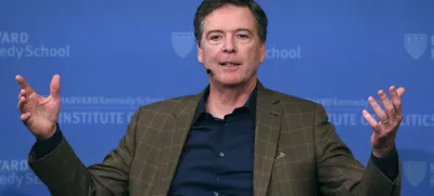 FILE - Former FBI director James Comey gestures while speaking at Harvard University's Institute of Politics' JFK Jr. Forum in Cambridge, Mass., Feb. 24, 2020. (AP Photo/Charles Krupa, File)