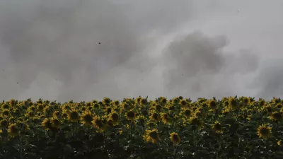 Smoke rises following an Israeli army airstrike in northern Gaza Strip, seen behind a sunflower field in southern Israel, Friday, May 16, 2025. (AP Photo/Maya Alleruzzo)