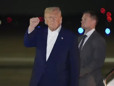 President Donald Trump gestures as he arrives on Air Force One, Friday, May 16, 2025, at Joint Base Andrews, Md. (AP Photo/Alex Brandon)