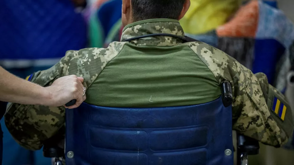 A Ukrainian serviceman, wounded during fighting with Russian forces, who is a patient of the Mechnykov Hospital, prepares for being transferred, amid Russia's attack on Ukraine, in Dnipro, Ukraine, May 14, 2025. REUTERS/Alina Smutko