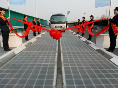 ﻿A vehicle is seen on a solar panel expressway during its opening in Jinan, Shandong province, China December 28, 2017. Picture taken December 28, 2017. REUTERS/Stringer ATTENTION EDITORS - THIS IMAGE WAS PROVIDED BY A THIRD PARTY. CHINA OUT.