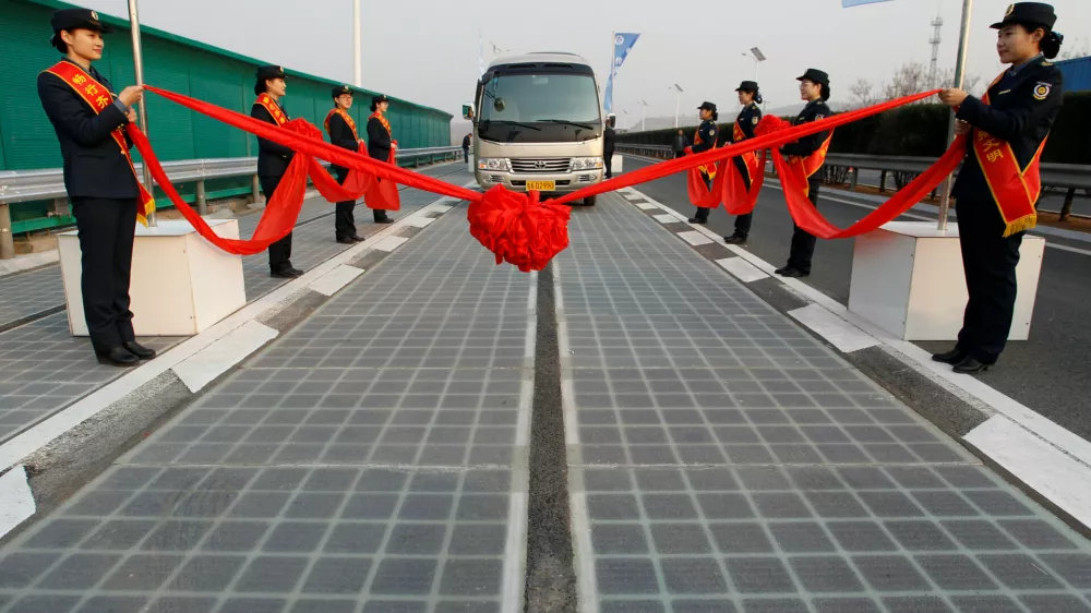 ﻿A vehicle is seen on a solar panel expressway during its opening in Jinan, Shandong province, China December 28, 2017. Picture taken December 28, 2017. REUTERS/Stringer ATTENTION EDITORS - THIS IMAGE WAS PROVIDED BY A THIRD PARTY. CHINA OUT.