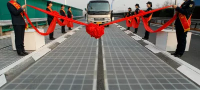 ﻿A vehicle is seen on a solar panel expressway during its opening in Jinan, Shandong province, China December 28, 2017. Picture taken December 28, 2017. REUTERS/Stringer ATTENTION EDITORS - THIS IMAGE WAS PROVIDED BY A THIRD PARTY. CHINA OUT.