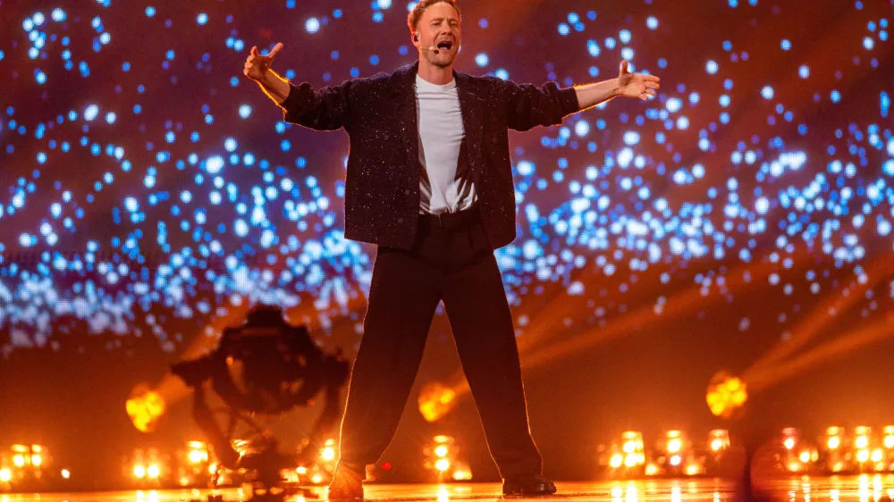 12 May 2025, Switzerland, Basel: Slovenia's Klemen Slakonja performs "How Much Time Do We Have Left?" during the rehearsal for the first semi-final begins on the stage of the Eurovision Song Contest (ESC) 2025 in the Arena St. Jakobshalle. Photo: Jens Büttner/dpa