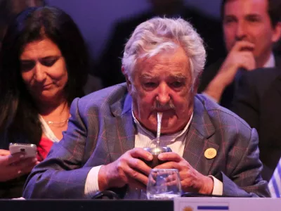 FILE PHOTO: Uruguay's President Jose Mujica drinks "mate", a traditional herbal infusion, at the opening ceremony of the Community of Latin American and Caribbean States (CELAC) summit in San Antonio de Belen province of Heredia, in this January 28, 2015 handout courtesy of the Costa Rica Presidency. REUTERS/Costa Rica Presidency/Handout via Reuters/File Photo. ATTENTION EDITORS - THIS PICTURE WAS PROVIDED BY A THIRD PARTY. REUTERS IS UNABLE TO INDEPENDENTLY VERIFY THE AUTHENTICITY, CONTENT, LOCATION OR DATE OF THIS IMAGE. FOR EDITORIAL USE ONLY. NOT FOR SALE FOR MARKETING OR ADVERTISING CAMPAIGNS. THIS PICTURE IS DISTRIBUTED EXACTLY AS RECEIVED BY REUTERS, AS A SERVICE TO CLIENTS.