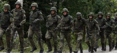 Bundeswehr German armed forces 701 tank battalion run during an exercise at a training area in Grafenwoehr near the southern German town of Nuremberg, August 24, 2010. The 701 tank battalion exercise a bridge building with U.S. army soldiers during their preparation for their deployment as ISAF troops to Afghanistan.   REUTERS/Fabrizio Bensch (GERMANY - Tags: POLITICS MILITARY)