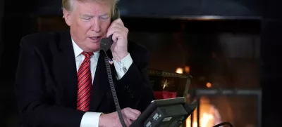 ﻿U.S. President Donald Trump participates in NORAD Santa tracker phone calls from the White House in Washington, U.S. December 24, 2018. REUTERS/Jonathan Ernst - RC16541E9E50