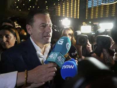 Incumbent Prime Minister and leader of the center-right Social Democratic Party Luis Montenegro arrives at the party's headquarters following Portugal's general election, in Lisbon, Sunday, May 18, 2025. (AP Photo/Armando Franca)